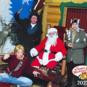 "Home Alone" cosplayers pose for a photo with Santa