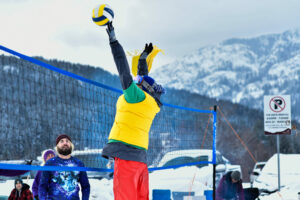 people play volleyball in the snow