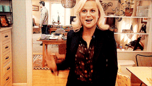 a gif of Leslie Knope from the show Parks and Rec doing a silly dance